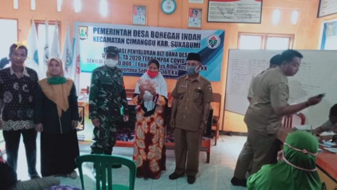 
					Danposramil Cimanggu Dampingi Pembagian BLT Tahap ke 2 Desa Boragah Indah