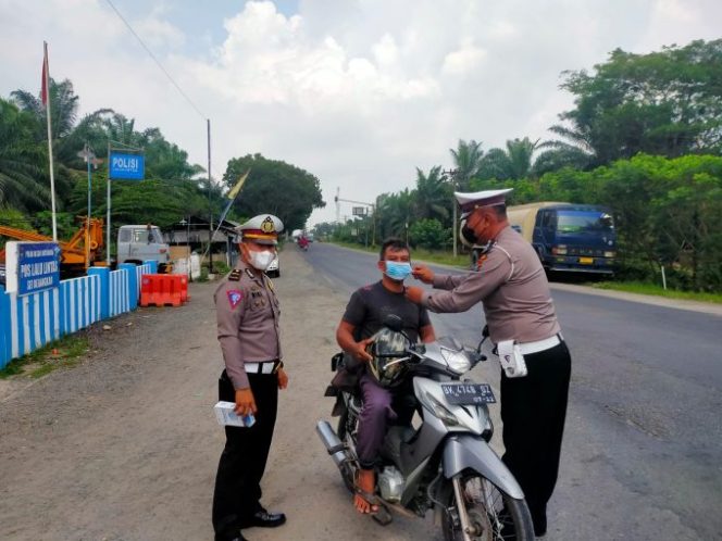 
					Tempat Umum Jadi Prioritas Polsek Labuhan Ruku Dalam Menggelar Ops Yustisi